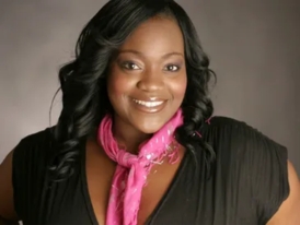 Portrait of Jaidz Majasi smiling, founder of Caeli Lumen, standing in a welcoming, softly lit space.